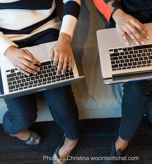 2 people on laptops